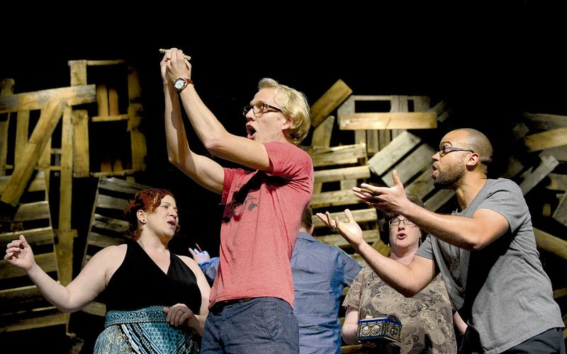 Kierstin Bible (from left), Judd Burns, Lisa Kulczak and Justin Stewart rehearse a scene from Mozart’s “The Magic Flute,” part of the Ozark Family Opera Company’s “A Night at the Opera!” scheduled for Saturday at Grace Point Church in Bentonville.