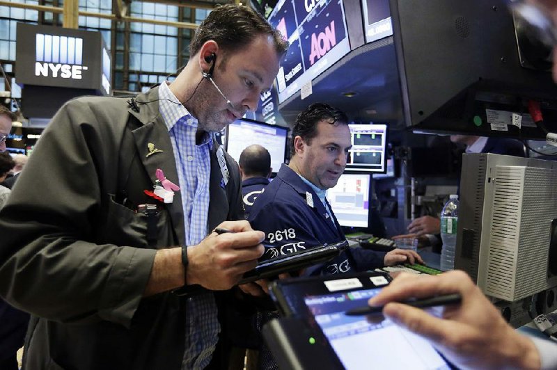 Trader Thomas Cicciari works Friday on the floor of the New York Stock Exchange. Stock indexes fell Friday, snapping a two-day winning streak. 