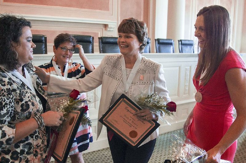 Ouida Newton (second from right), from Poyen High School, is shown in this file photo with, from left, Lindsay Griffin, from Greenbrier Middle School, Donna Dillahunty, from Marion Intermediate School, and ayna Moffit, from Lincoln Junior High School.