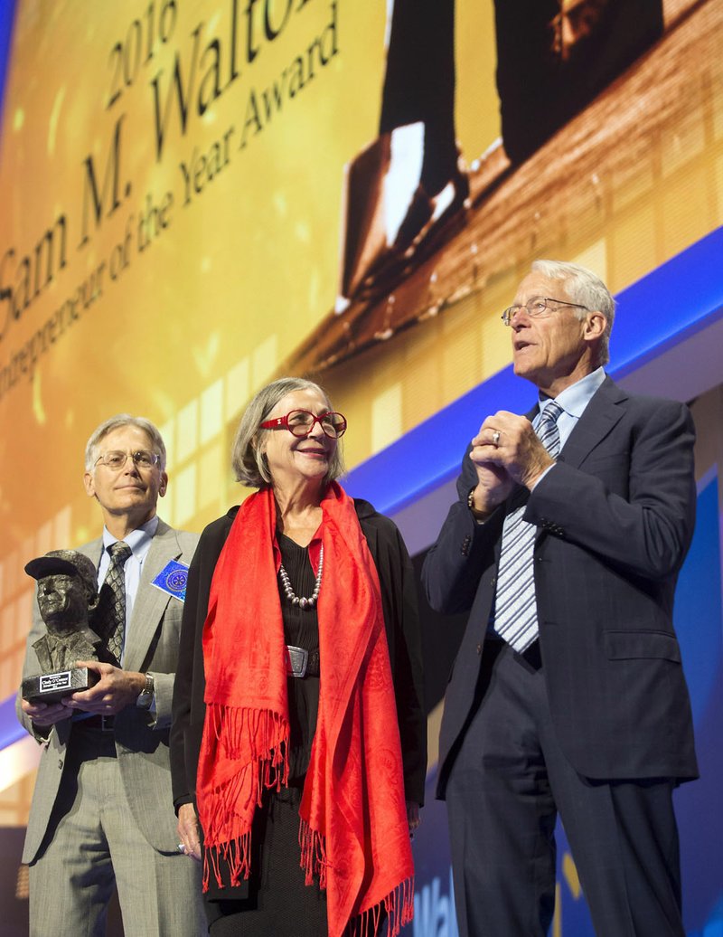 Jim Walton (from left), Alice Walton and Rob Walton take the stage at Wal-Mart Stores Inc.’s shareholders meeting Friday. It was Jim Walton’s final meeting as a member of the company’s board of directors. His son Steuart is replacing him. 
