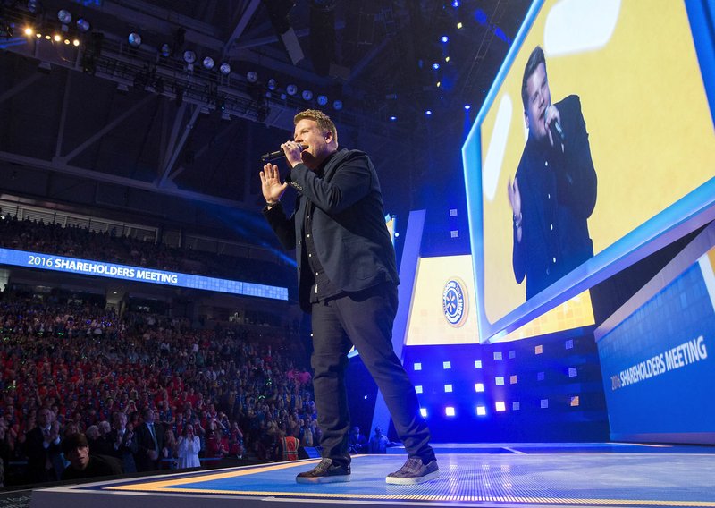 Celebrity host James Corden speaks Friday during Wal-Mart’s Shareholders Meeting at Bud Walton Arena in Fayetteville. 