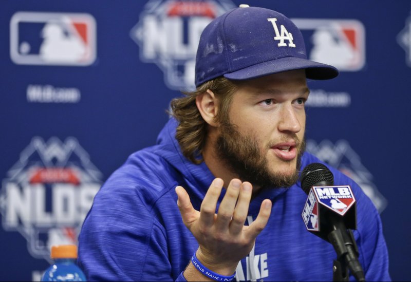 In this Oct. 12, 2015, file photo, Los Angeles Dodgers starting pitcher Clayton Kershaw speaks during a news conference before Game 3 of baseball's National League Division Series, at CitiField in New York. 