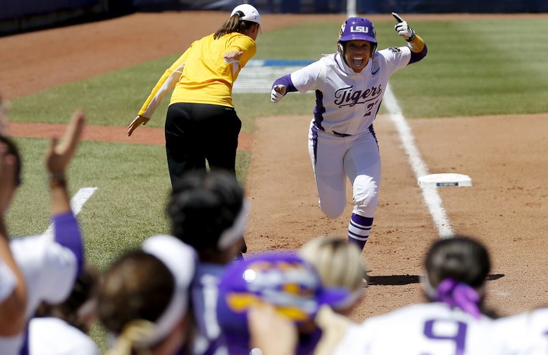 LSU's Bianka Bell runs home after hitting a two-run home run in the first inning of a softball game in the Women's College World Series between Georgia and LSU at in Oklahoma City, Sunday, June 5, 2016.