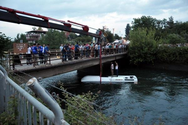 Turkish rescuers lift a bus from a canal near Osmaniye, Turkey, on Monday.