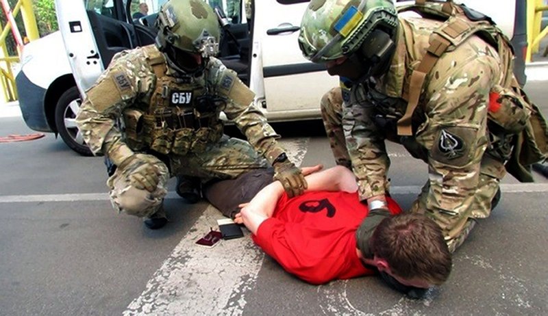 In this image, provided by the Ukrainian Intelligence Agency SBU on Monday, June 6, 2016, SBU agents detain a suspect at the Yahodyn border crossing on the Ukrainian-Polish border, Ukraine. 