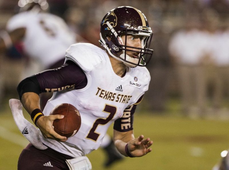 Texas State quarterback Tyler Jones runs during the first half of an NCAA college football game against Florida State in Tallahassee, Fla., Saturday, Sept. 5, 2015. (AP Photo/Mark Wallheiser)