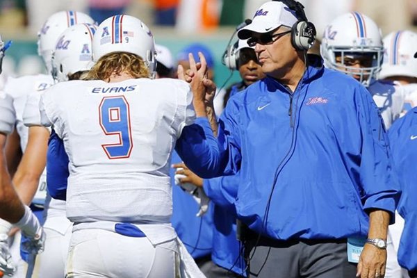 Tulsa head coach Bill Blankenship congratulates quarterback Dane Evans after Evans scored a touchdown during the second quarter of a college football game against Colorado State Saturday, Oct. 4, 2014, in Fort Collins, Colo. (AP Photo/Jack Dempsey)