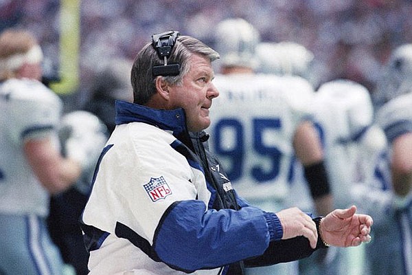 Dallas Cowboys coach Jimmy Johnson cheers on his players in the first quarter against the Green Bay Packers, Sunday, Jan. 16, 1994 in Irving, Texas. (AP Photo/Pat Sullivan) 