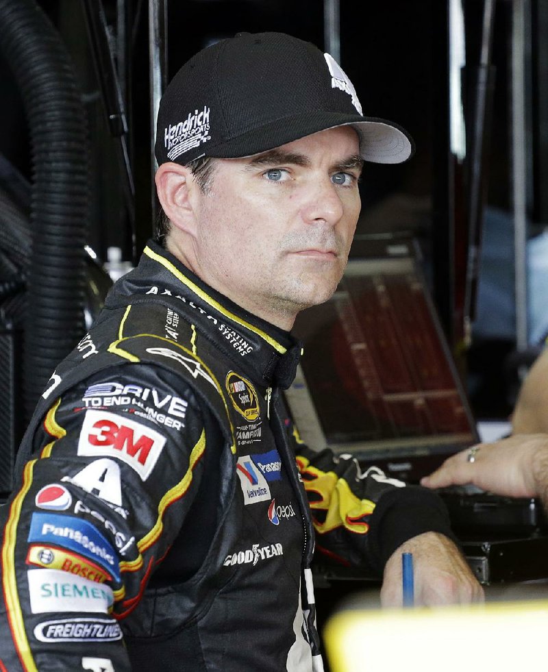 Jeff Gordon looks on in the garage area before the NASCAR Sprint Cup Series practice auto race, Saturday, Nov. 21, 2015, at Homestead-Miami Speedway in Homestead, Fla. 