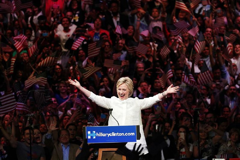 Hillary Clinton acknowledges a raucous crowd Tuesday night at a victory rally in Brooklyn, N.Y.