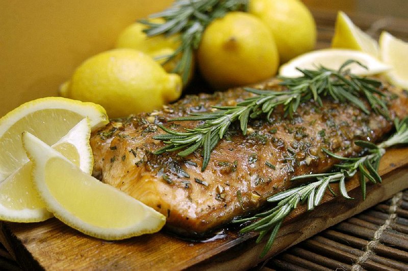 Grilling salmon on a cedar plank creates moist, smoky fish that can be served right on the plank. 
