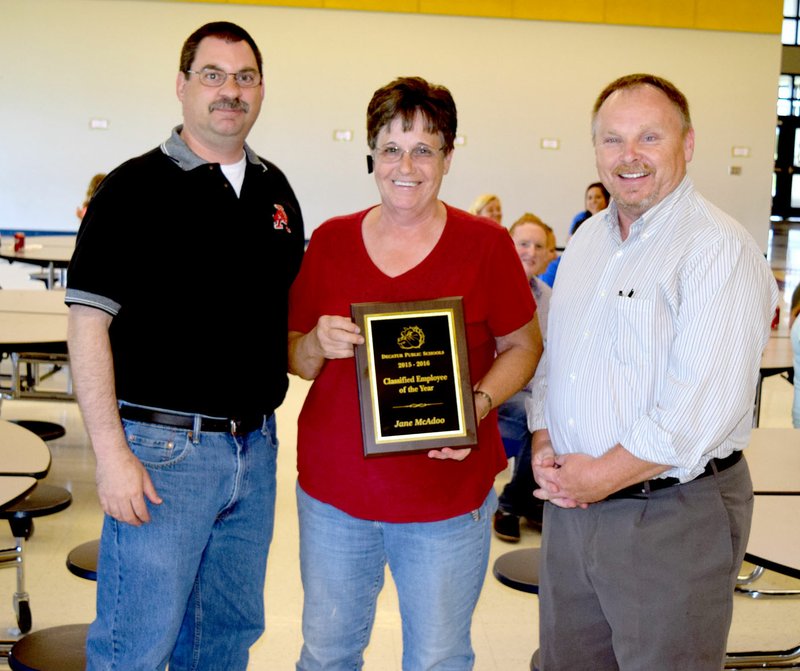 Photo by Mike Eckels Jane McAdoo (center) received the Classified Employee of the Year award from Cary Stamps (left), Decatur Northside Elementary principal, and Toby Conrad, Decatur High School principal, during the classified employee luncheon in the cafeteria of Northside Elementary May 25.
