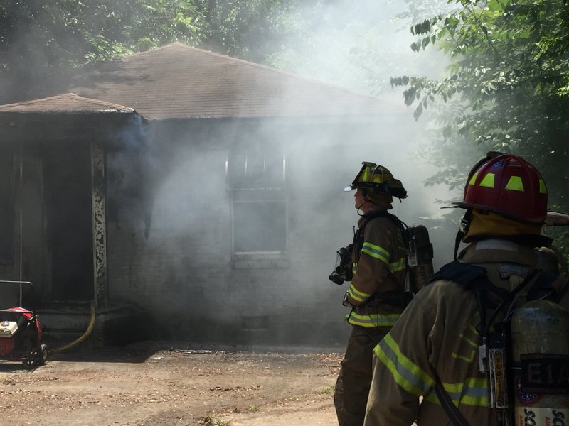 Little Rock firefighters douse a blaze at home in the 2100 block of Maryland Avenue on Wednesday, June 8, 2016. 