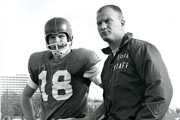 Arkansas assistant coach Barry Switzer, right, talks with Jim Lindsey during practice Nov. 17, 1965, in Fayetteville. 