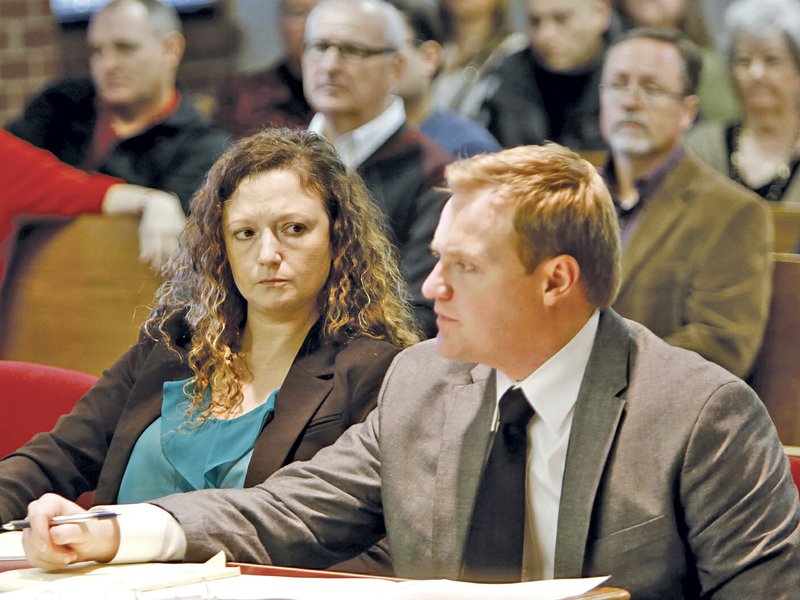 Heather Carlene Swain (left), one of four Prairie Grove residents charged in the beating death of Ronnie Lee Bradley, sits in January 2014 with her attorney Tyler Benson in Judge William Storey's courtroom at the Washington County Courthouse in Fayetteville.