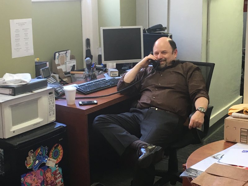 Seinfeld actor Jason Alexander answers calls at the Arkansas Repertory Theatre's box office Friday morning to promote opening night of Windfall, which he is directing. 