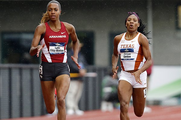 Arkansas' Taylor Ellis-Watson, left, and Texas' Chrisann Gordon, right, compete in a women's 400-meter semifinal at the NCAA outdoor track and field championships in Eugene, Ore., Thursday, June 9, 2016. (AP Photo/Ryan Kang)