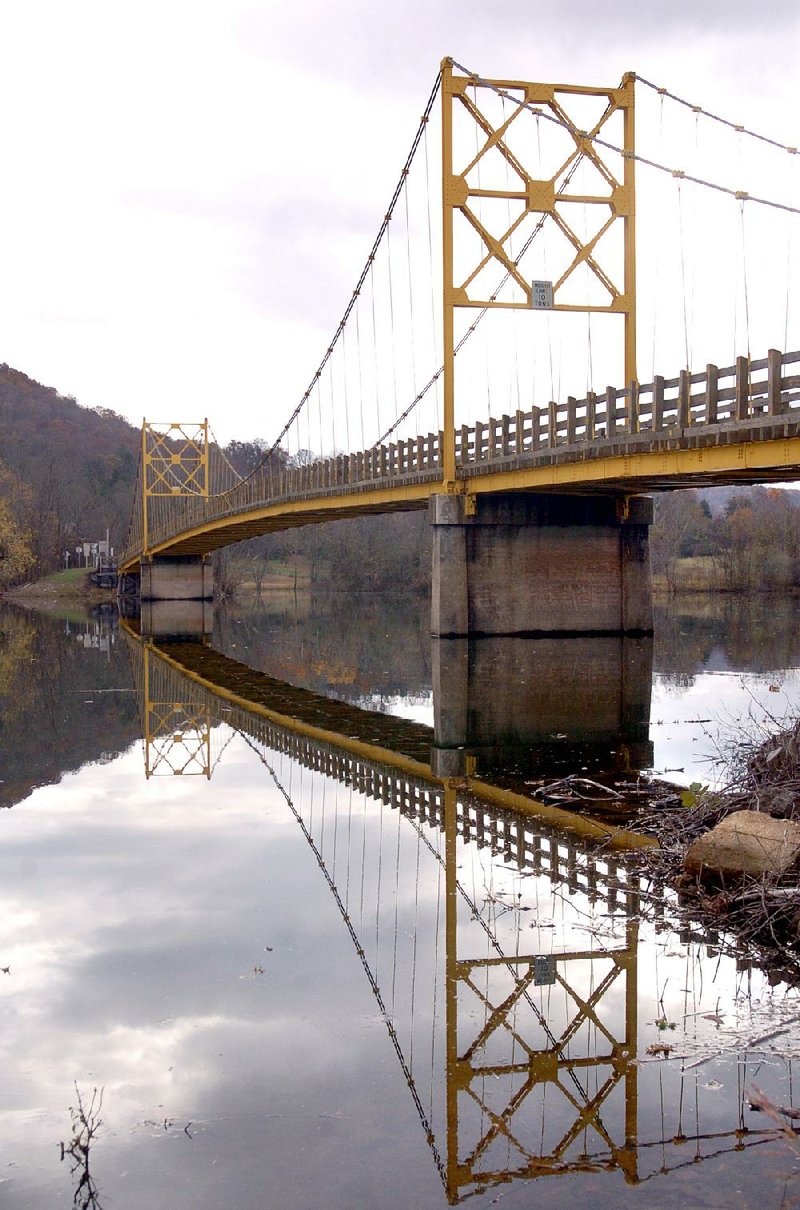 Arkansas Democrat-Gazette/LORI McELROY

The one-lane suspension bridge in Beaver.

11-16-04