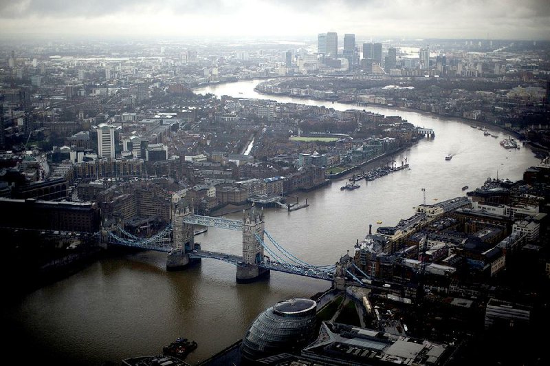 Beyond London’s Tower Bridge in the distance stand the skyscrapers of the Canary Wharf business district, home to international banks, where many in the financial industry are fi lled with anxiety as they await the outcome of the British referendum on EU membership on June 23.