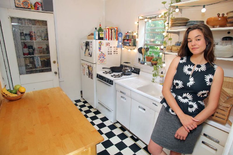 Rachael Borne in her kitchen. She is the reentry coordinator at Our House and this is her first apartment in Little Rock after college.