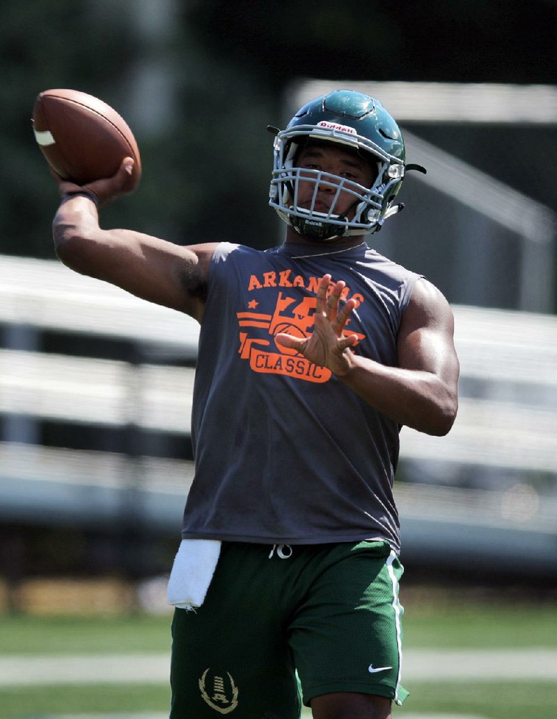 Alma Quarterback Noah Dotson attempts a pass June 10 during the Championship game of the 7-on-7 Classic at Little Rock Christian High School. 