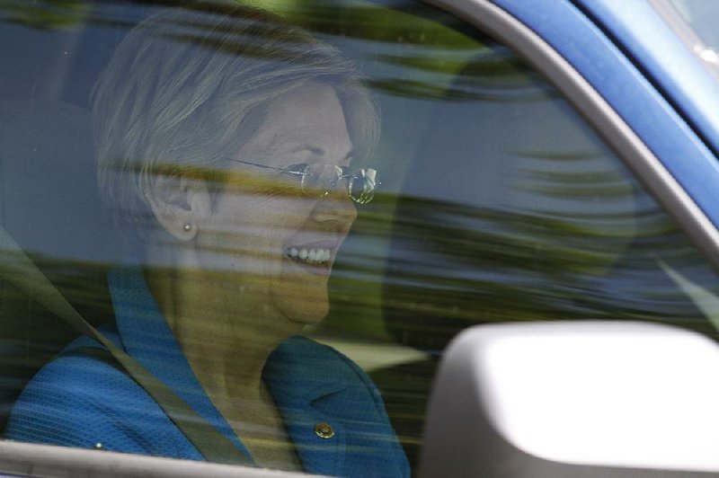 Sen. Elizabeth Warren leaves Hillary Clinton’s Washington home after a private meeting Friday morning. 