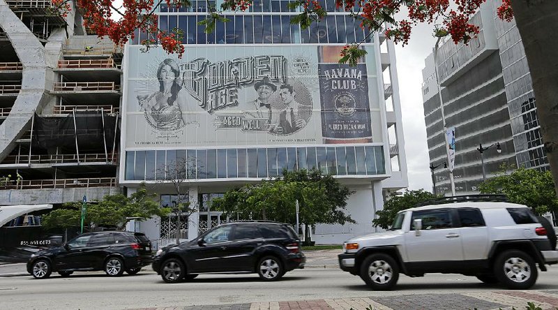 Cars pass a Havana Club billboard on Biscayne Boulevard in downtown Miami. New marketing campaigns for Bacardi’s Havana Club rum and Pernod Ricard’s Havana Club rum highlight the battle between the liquor giants to use the name. 