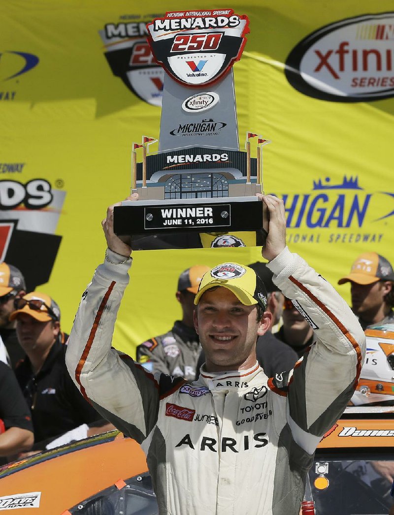 NASCAR Xfinity Series driver Daniel Suarez celebrates after winning the NASCAR Xfinity series auto race at Michigan International Speedway on Saturday.