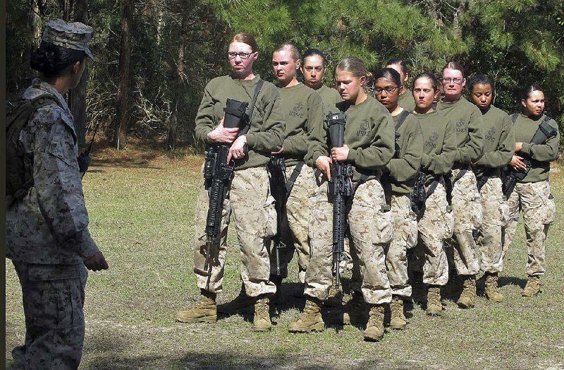 Women recruits gather at the Marine Corps Training Depot at Parris Island, S.C., in February 2013. “In the overall scheme it’s a small thing” to change position titles to more inclusive names, Secretary of the Navy Ray Mabus said. “But I think it’s important because it’s what sailors and Marines call each other, and words do matter.” 