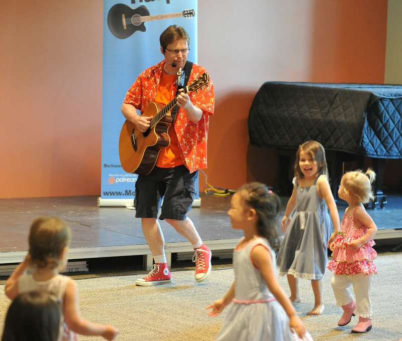 Monty Harper, a children’s songwriter and performer based in Stillwater, Okla., performs for kids Saturday at the Fayetteville Public Library.