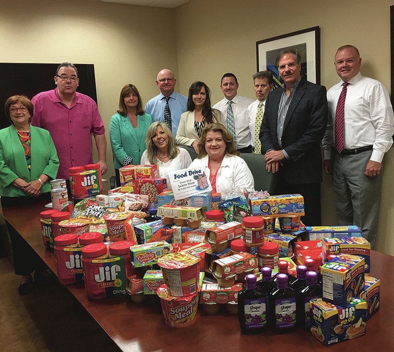 Submitted photo June is the Global Volunteer Month for Morgan Stanley. In keeping with tradition, the employees of the local branch participated in a food drive to benefit Jackson House. From standing left are Susan Goltz Siegel, Brad Jolley, Denise Franks, Robert Walker, Tina Smoot-Donoho, John Adamkiewicz, Mike Adamkiewicz, Brad Hudgens, Dennis Berry; sitting, Debby Butler and Janie Smith, coordinator of Eleanor Klugh Jackson House for Crisis Intervention. Morgan Stanley Wealth Management is located at 4262 Central Ave., Suite A. Call 501-624-5215 for information.