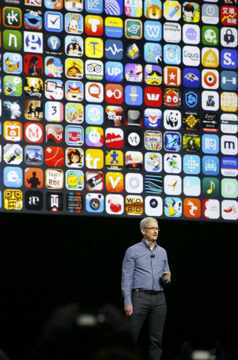 Apple CEO Tim Cook speaks Monday at the Apple Worldwide Developers Conference in the Bill Graham Civic Auditorium in San Francisco.