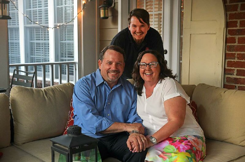 Marshall Taliaferro (center) moved back in with his parents, Will and Courtney Taliaferro, in Leesburg, Va. A recent survey found 32 percent of 18- to 34-year-olds live with their parents. 