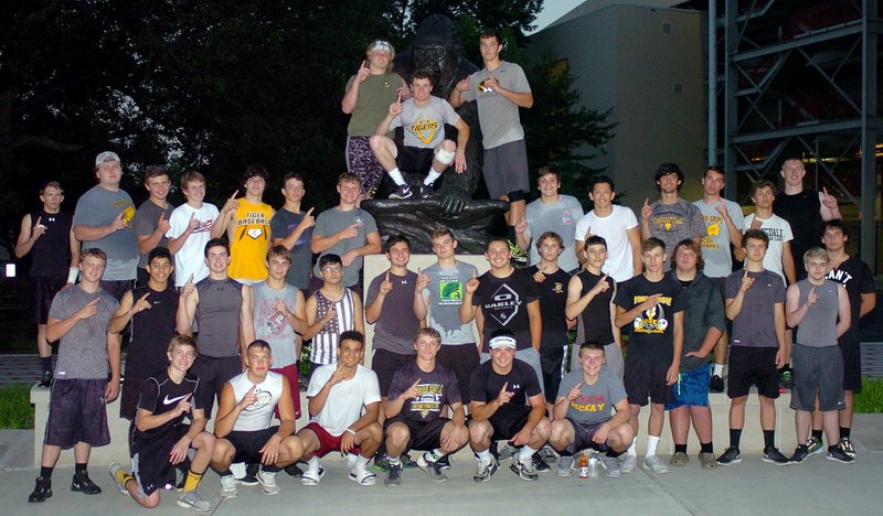 MIKE CAPSHAW ENTERPRISE-LEADER Prairie Grove football players are all smiles while posing for a photo around the Gorilla statue outside of Carnie Smith Stadium on the campus of Pitt State University in Pittsburg, Kan. The Tigers were there for Coach Tim Beck&#8217;s Team Camp from June 9-11.