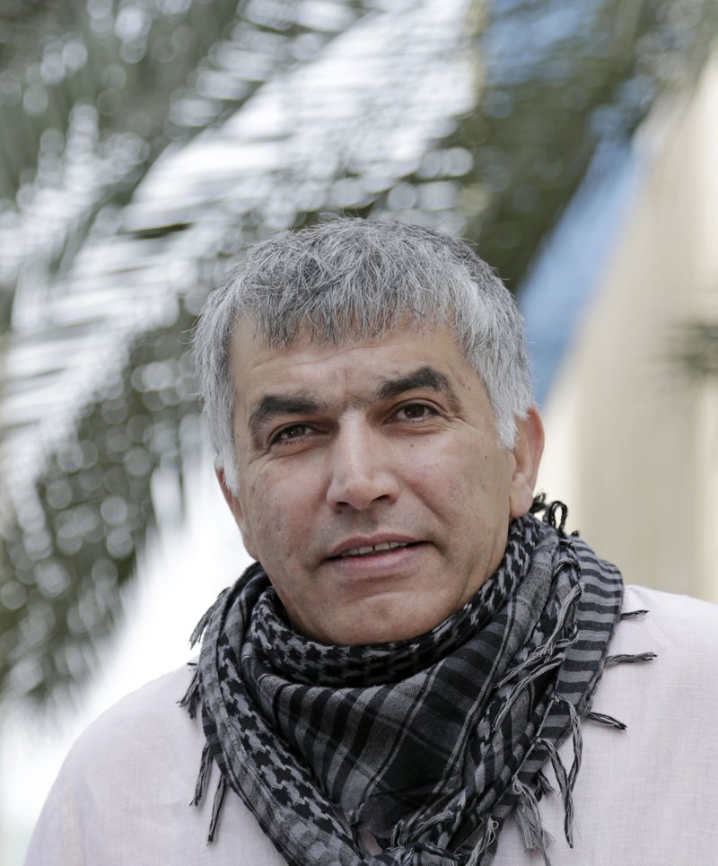 In this Wednesday, Feb. 11, 2015 file photo, Nabeel Rajab, one of Bahrain's best-known human rights activists, walks toward the courthouse to attend his appeal hearing in Manama, Bahrain. 