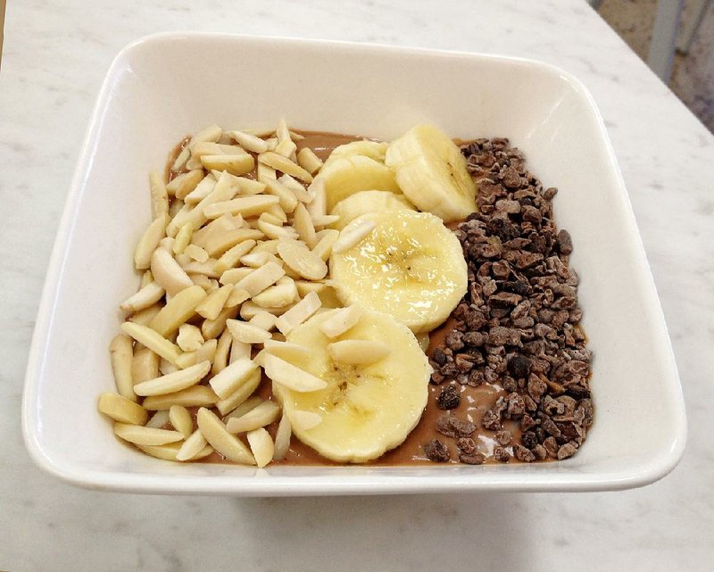 Almond slices, cacao nibs and bananas make Juice Leaf’s Chocolate Heaven smoothie bowl heartier. 