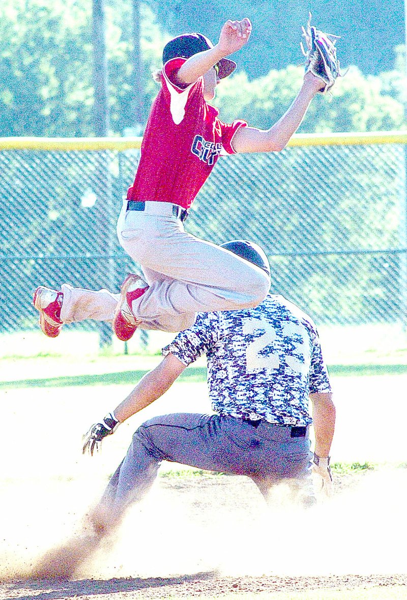 McDonald County second baseman Boston Dowd goes up to bring down a high throw on a stolen base attempt during McDonald County&#8217;s 6-2 loss on June 7 at McDonald County High School.