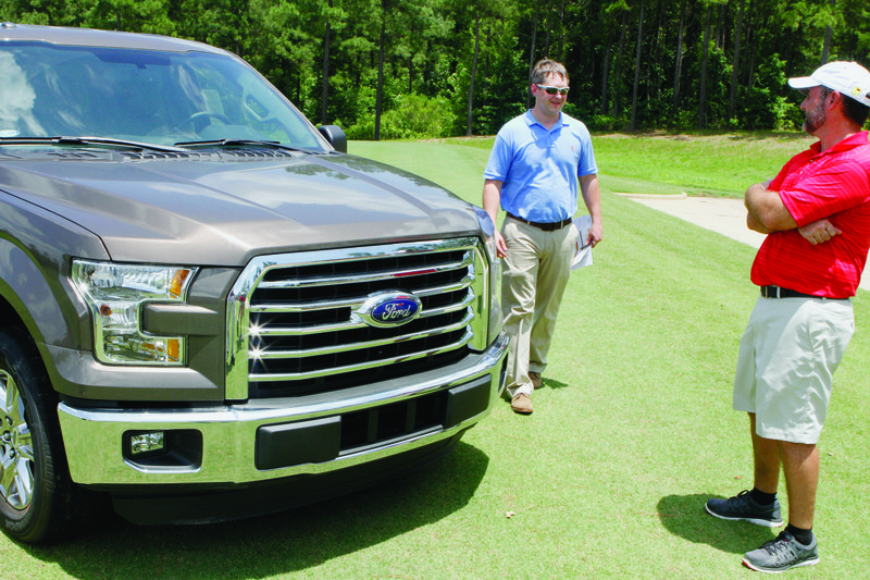 Truck: Jimmy Langley, left, of Smackover Motors presents Jeremy Jerry with a brand new Ford F-150 pickup truck. Jerry won the truck after using a 6-iron and hitting the ball 175 yrds for a hole-in-one on the fourth hole at Mystic Creek Golf Course during the 'Delek Tournament for Hope' at El Dorado. This is the fourth year for the 3-day golf tournament, which also includes a skeet shoot, cook-off, dinner and reception. Proceeds from the event benefit 13 local charities-American Cancer Society’s Relay for Life, Boys and Girls Club of El Dorado, Agapé House Helping Hands Food Bank, Hope Landing, Turning Point, Character First, Ducks Unlimited of Union County, H.O.P.E. Development Center, the South Arkansas Community College Foundation, United Way of Union County, Camp Fire El Dorado and Hannah Pregnancy Center.