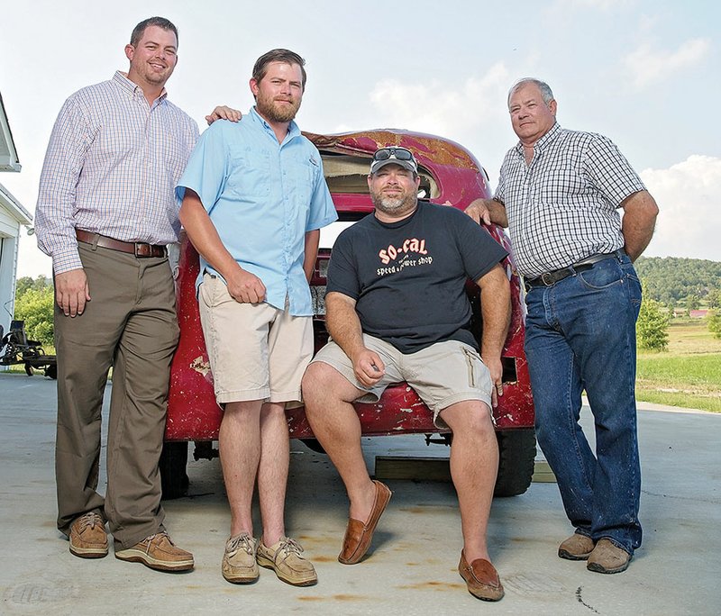 The three Shannon brothers, from left, Kerry, Terry and Jerry, pose with their dad, Dicky Shannon, and Dicky’s 1939 Chevrolet sedan that was damaged in the 2014 tornado that tore through Vilonia. Dicky bought each of the boys a car when they were teenagers and helped them restore the vehicles — two of which were damaged in the tornado.