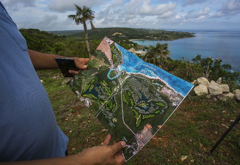 Guy Chartier, president of Wilton Properties Ltd. and project head of Montreal-based developer 360 Vox, earlier this month shows the map of luxury hotels and a golf course projected to be built near Jibacoa, Cuba. 