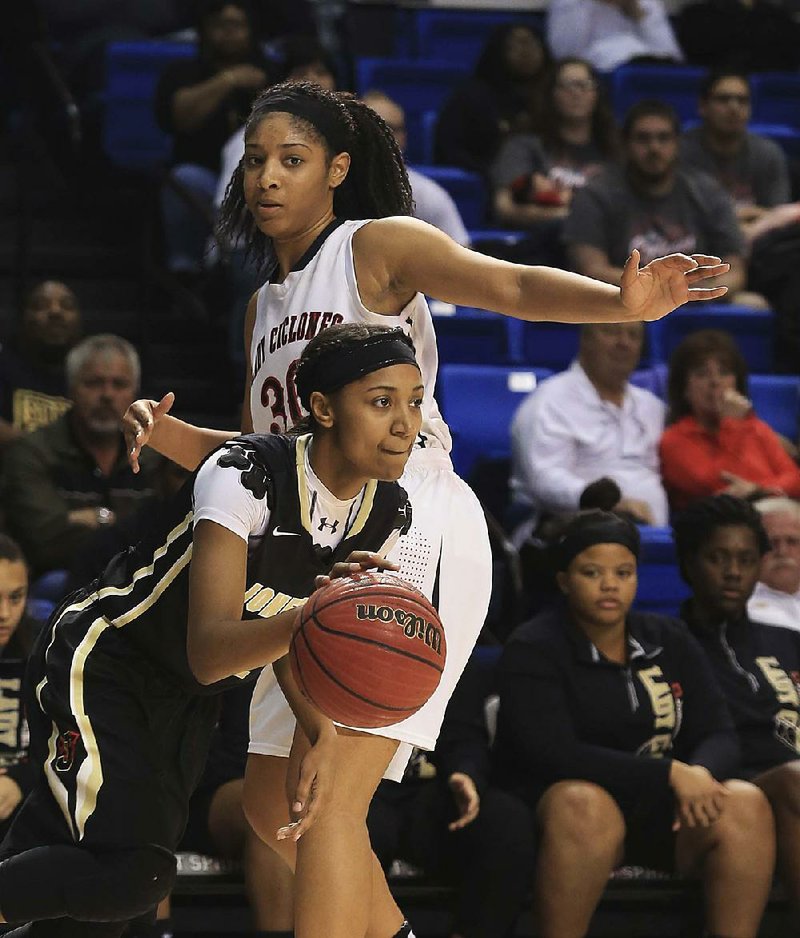 Jonesboro’s Starr Taylor (front) used her intensity, hustle and defense to help turn the Lady Hurricane into a state champion for the first time. 