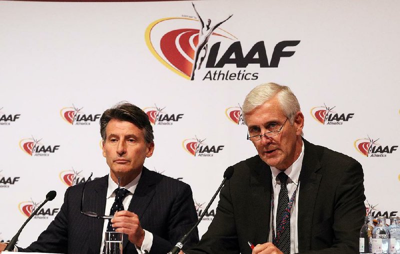 International Association of Athletics Federations President Sebastian Coe (left) and IAAF inspection team chairman Rune Andersen discuss the panel’s decision to ban Russia’s track and fi eld team from the Rio de Janeiro Olympics because of systematic doping.