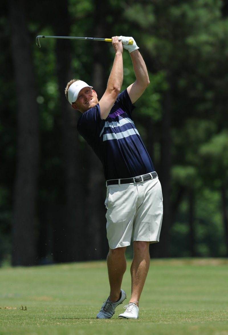 Steven Dixon hits his second shot Friday, June 17, 2016, on the second hole during the 78th annual Chick-A-Tee at Springdale Country Club in Springdale. The three-day tournament continues today.