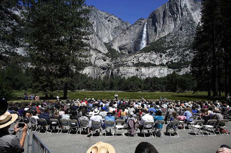 President Barack Obama addresses climate change Saturday during a news conference in Yosemite National Park’s Cook’s Meadow in California.