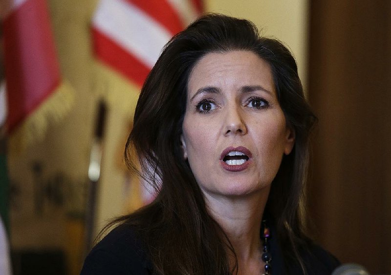 This June 15, 2016, file photo shows Oakland Mayor Libby Schaaf answering questions during a news conference at City Hall in Oakland, Calif. 