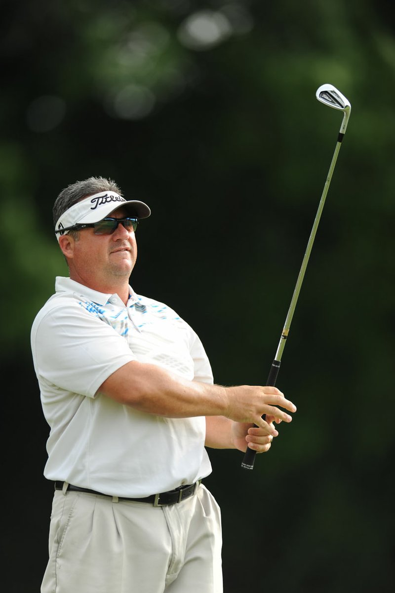 Chris Collins tees off on the 13th hole Saturday, June 18, 2016, during the 78th annual Chick-A-Tee at Springdale Country Club in Springdale. The three-day tournament concludes today.