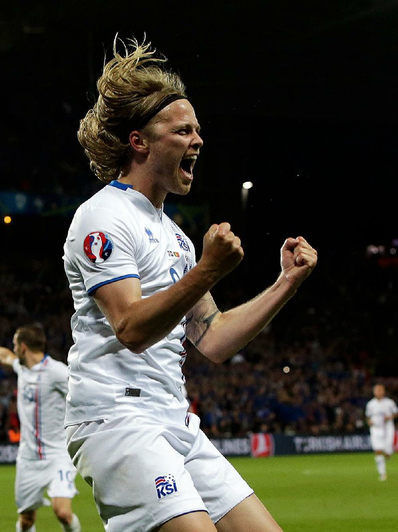Iceland’s Birkir Bjarnason celebrates after scoring a goal during a match against Portugal in the UEFA European
Championships. Iceland was playing in its first Euro championship tournament, much to the delight of its fans.