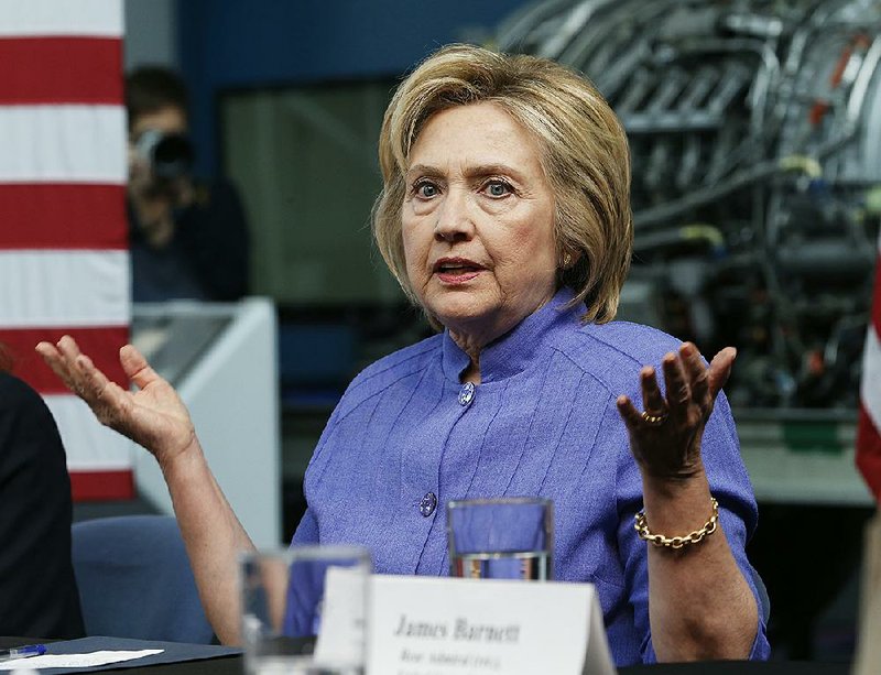 Democratic Presidential candidate Hillary Clinton gestures during a panel discussion on national security, Wednesday, June 15, 2016, at the Virginia Air and Space Museum in Hampton, Va. 