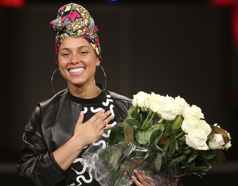 In this photo taken on Monday, May 23, 2016, singer Alicia Keys acknowledges the applause of the audience after she performs at the Italian State RAI TV program "Che Tempo che Fa, in Milan, Italy. 