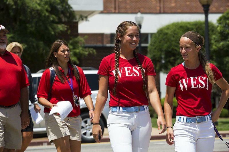 West All Star softball player Andee Tiffee (center) overcame an elbow injury before her sophomore season and a knee injury before her junior year to total 347 strikeouts this season in helping Fort Smith Southside to the Class 7A state tournament.
